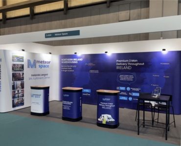 Meteor Space exhibition stand setup at January Furniture Show 2025, displaying 2-man delivery and warehousing services.