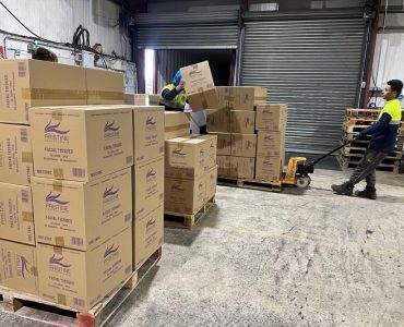 Meteor Space staff preparing Black Friday shipments, picking and palletising product cartons.